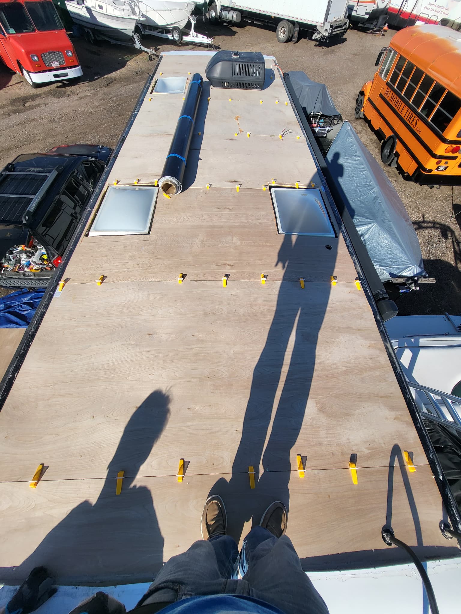 Plywood decking reinforced before TPO membrane installation on RV roof