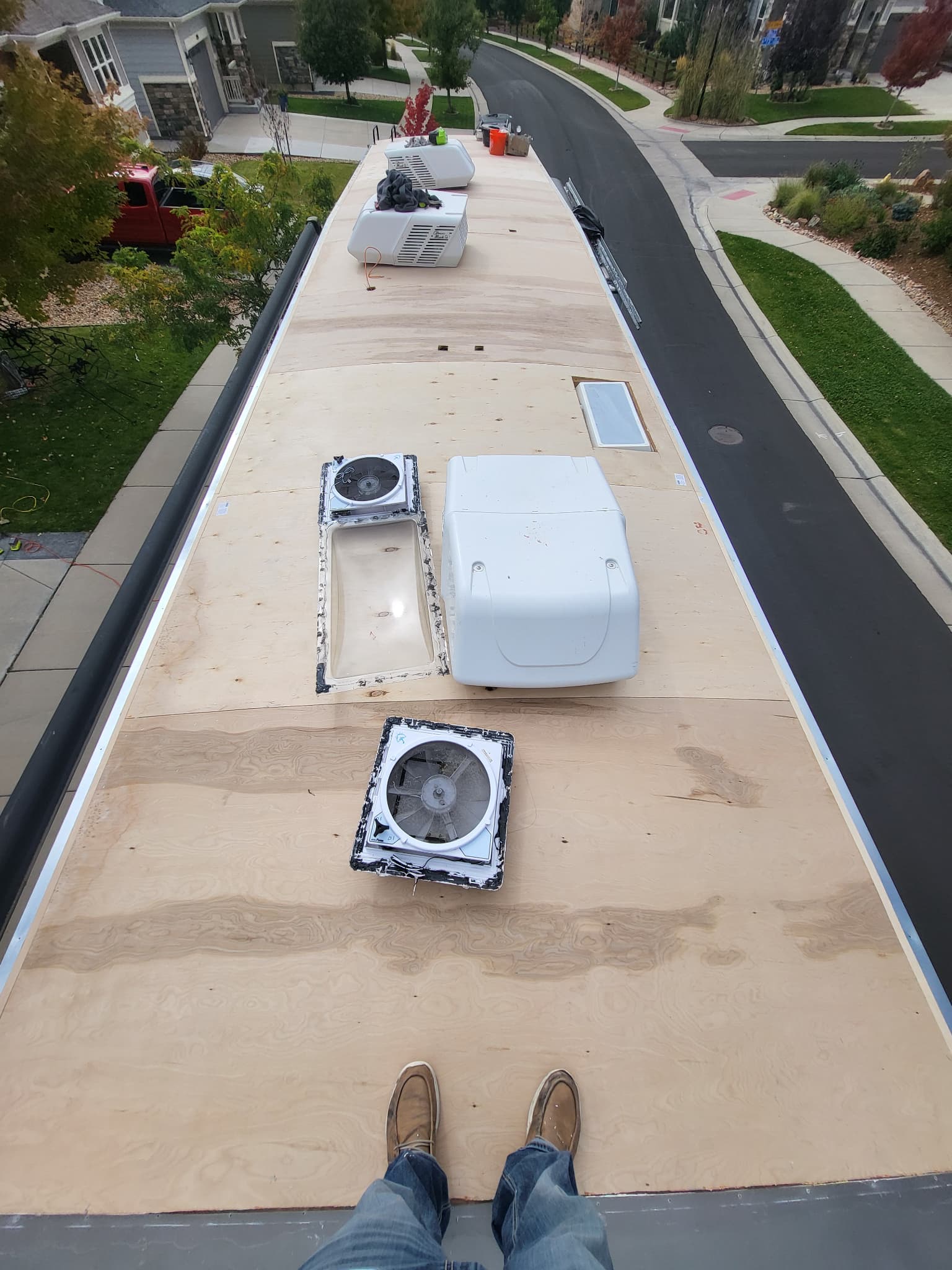 New plywood decking installed on RV roof during replacement