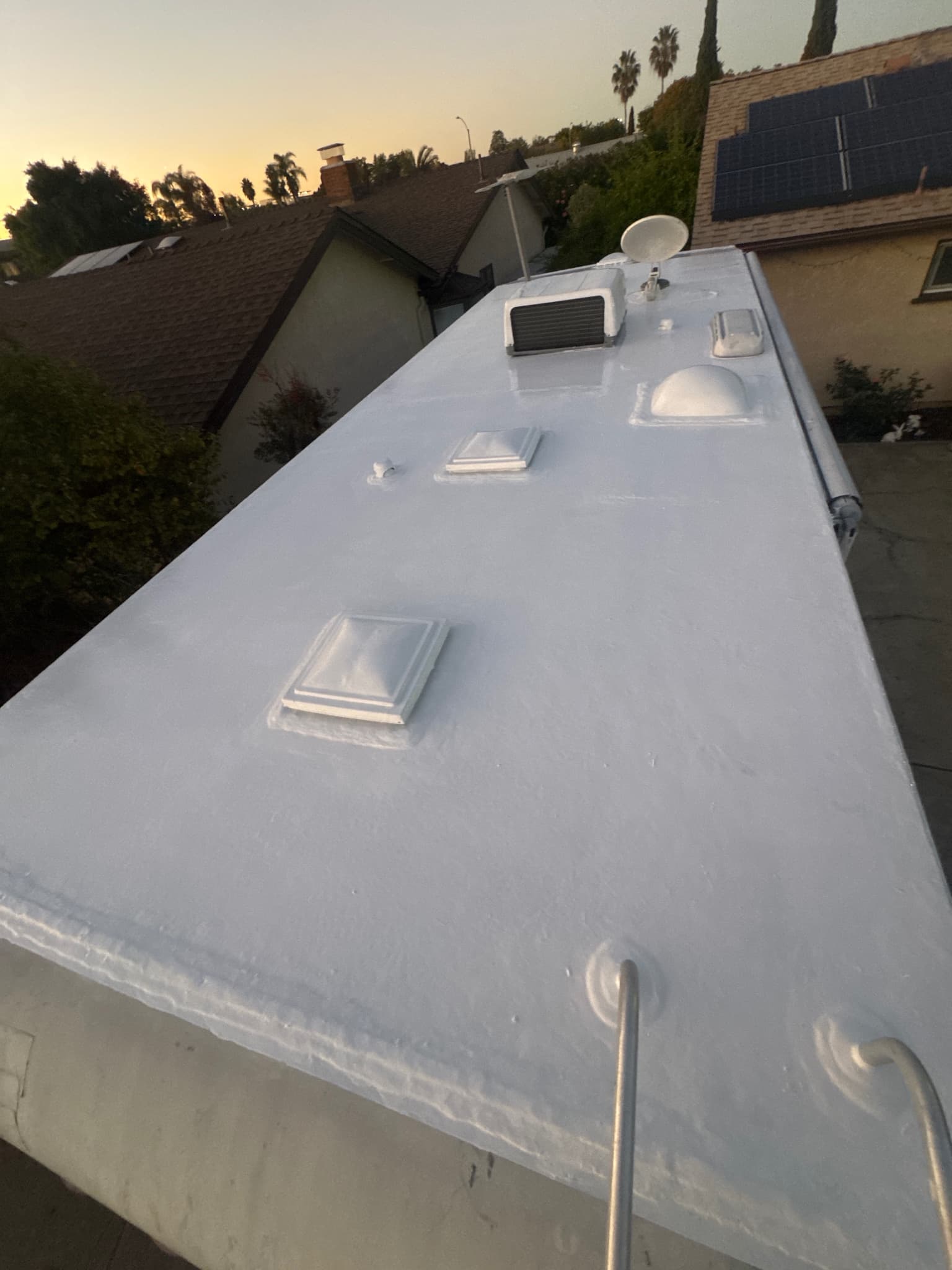 Finished RV roof with sealed seams and restored surface