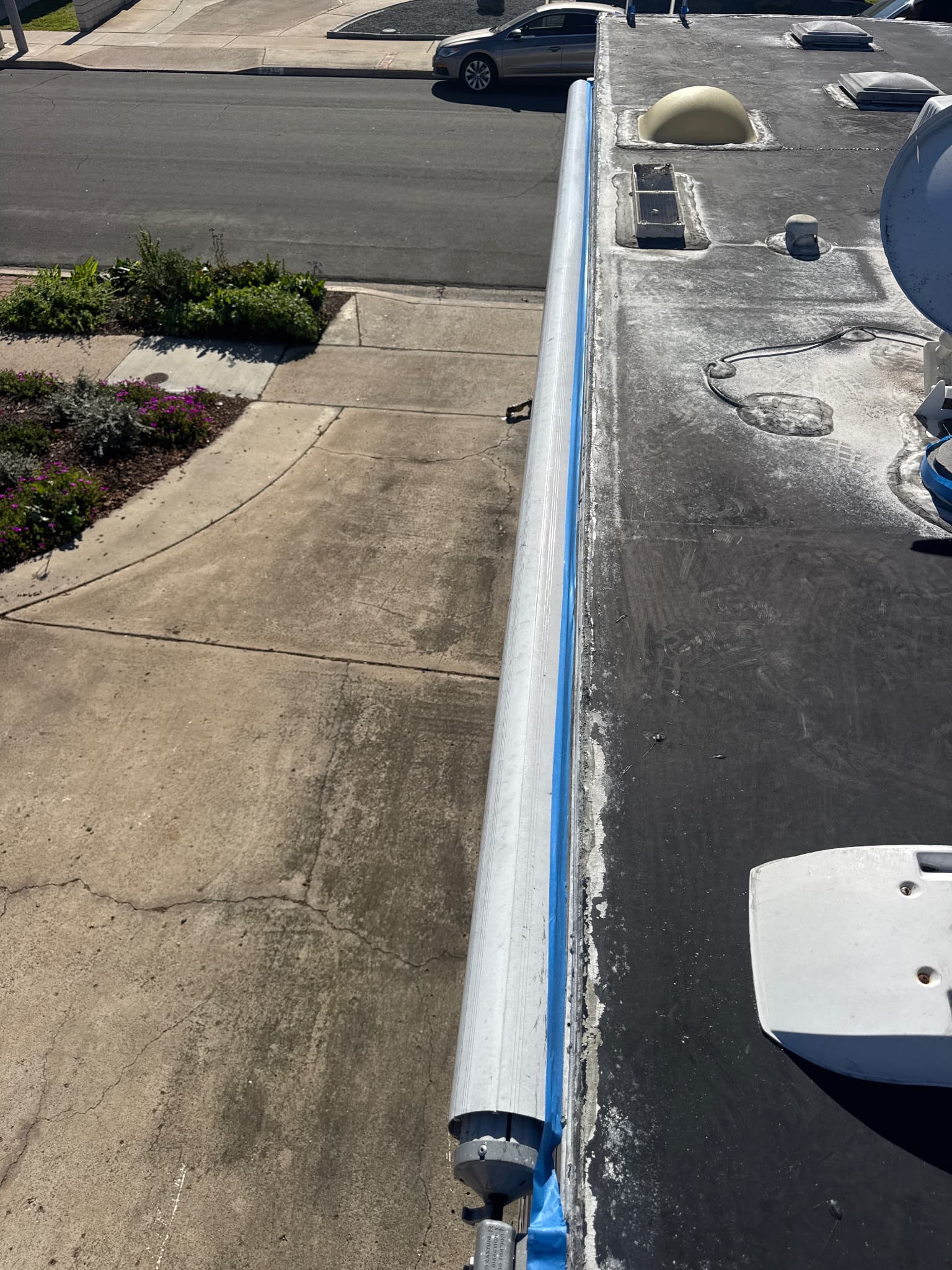 Masking tape applied on RV roof during preparation stage