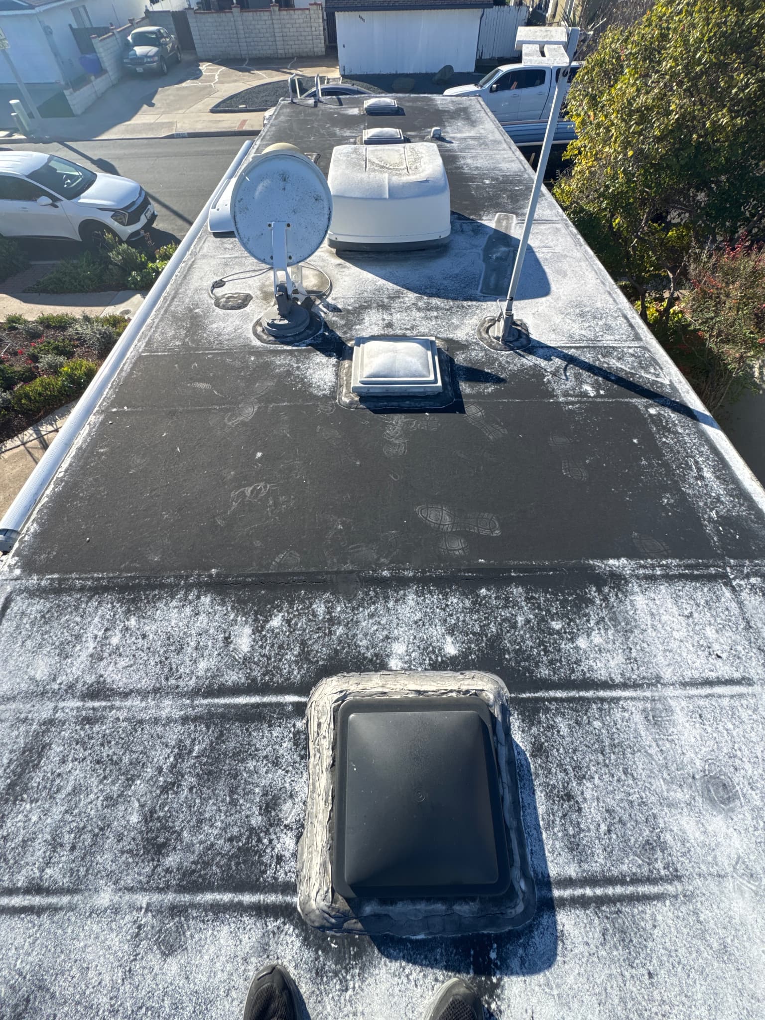 Damaged RV roof with worn sealant before repair in San Diego
