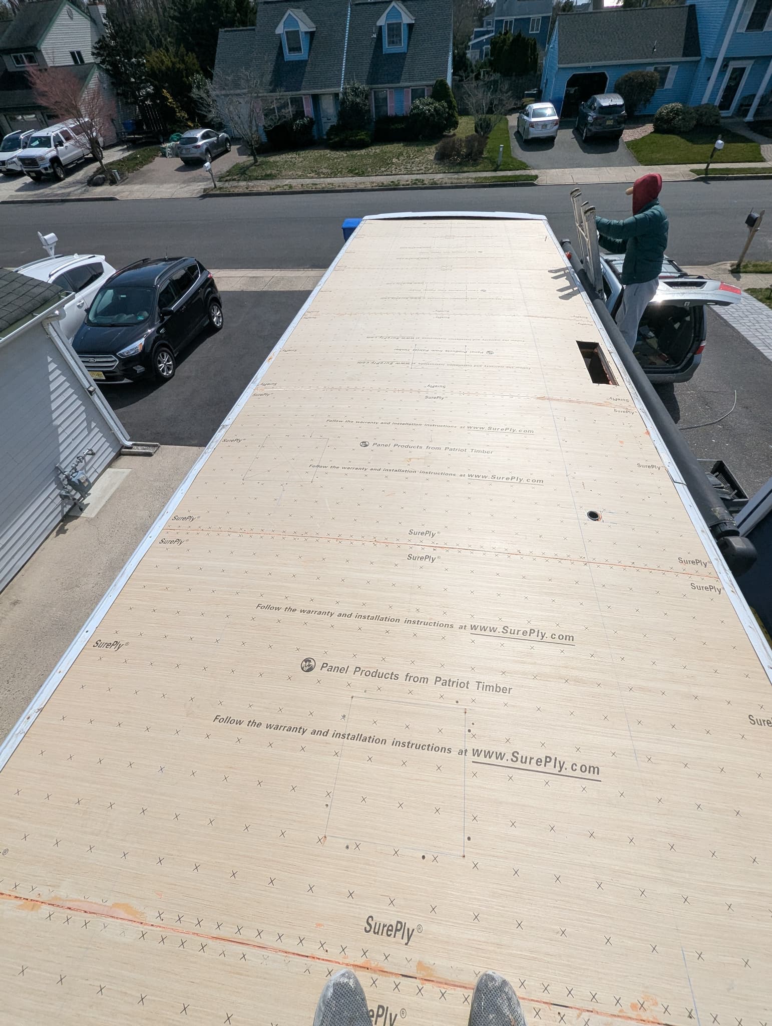 New plywood installed on RV roof during replacement process