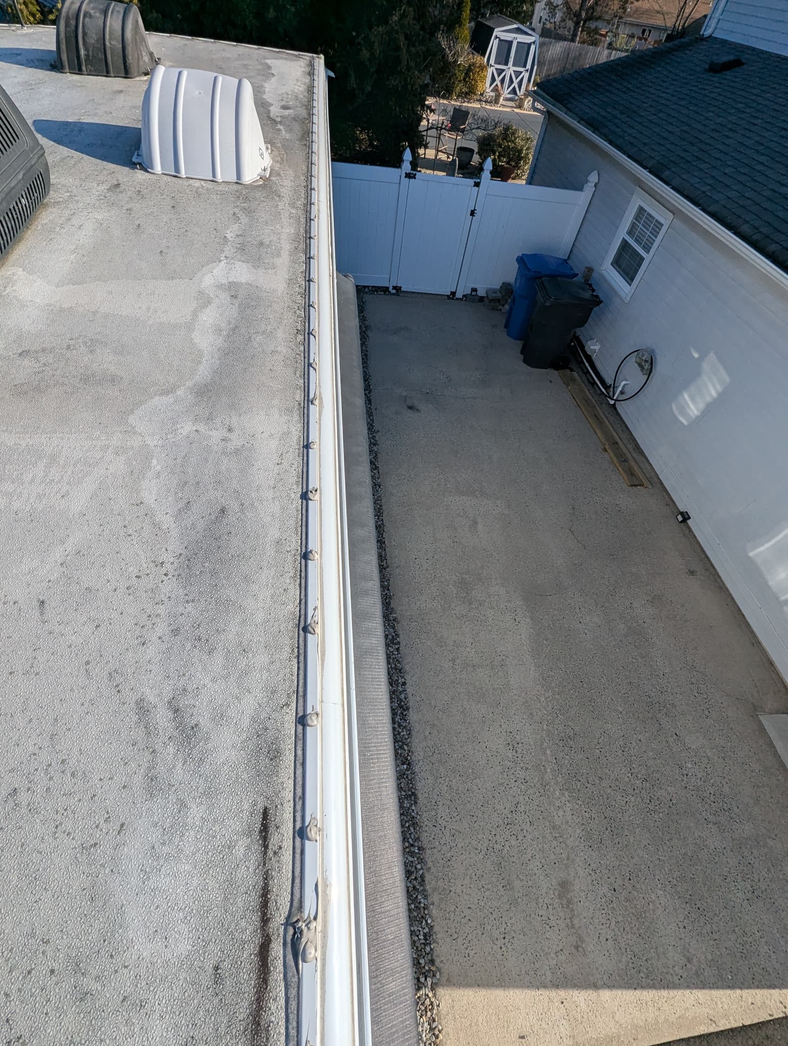 RV roof before repair with visible leak stains and damaged TPO membrane