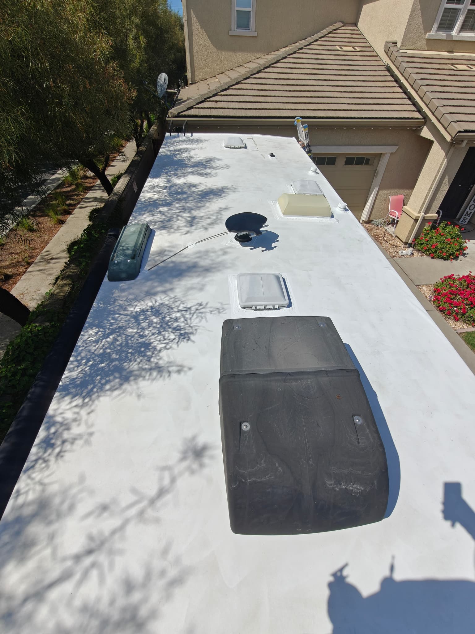 Finished RV roof after maintenance with sealed seams and clean surface
