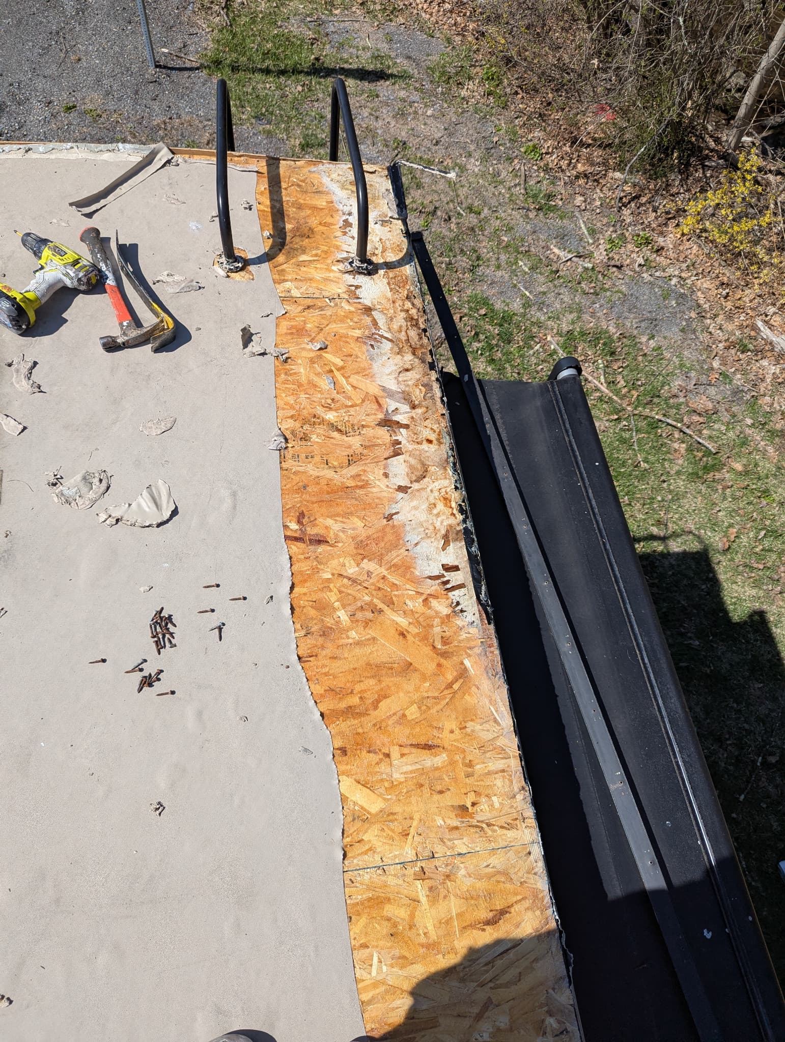 Damaged OSB decking exposed during RV roof replacement process