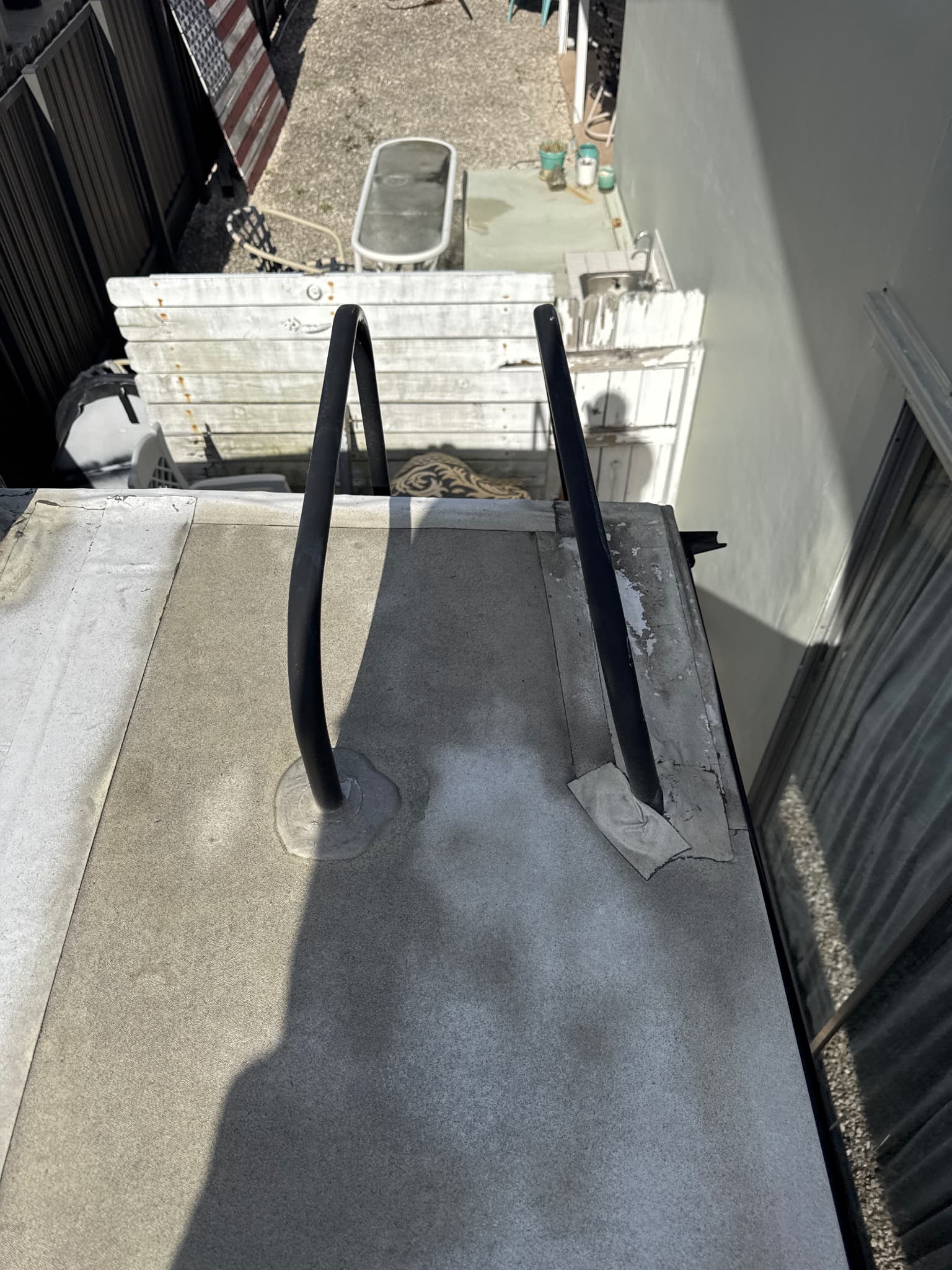 Ladder mounts on RV roof with taped sealant failing and causing leaks