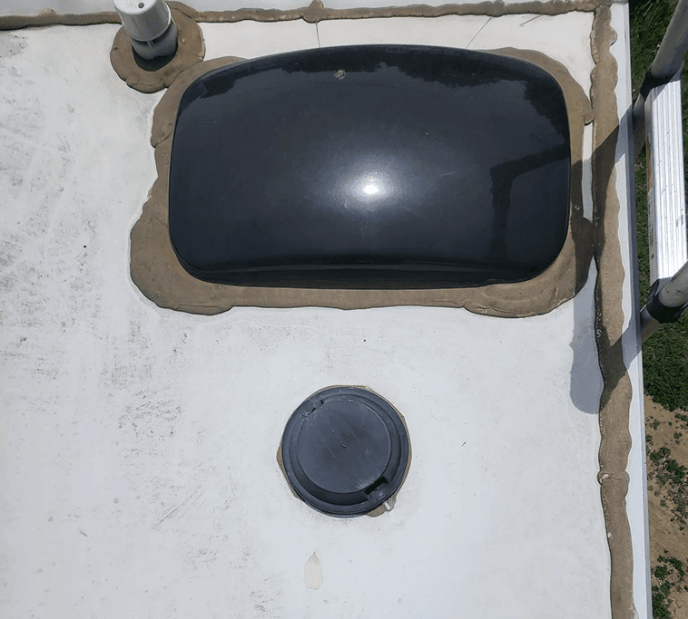 Old sealant around skylight and vent