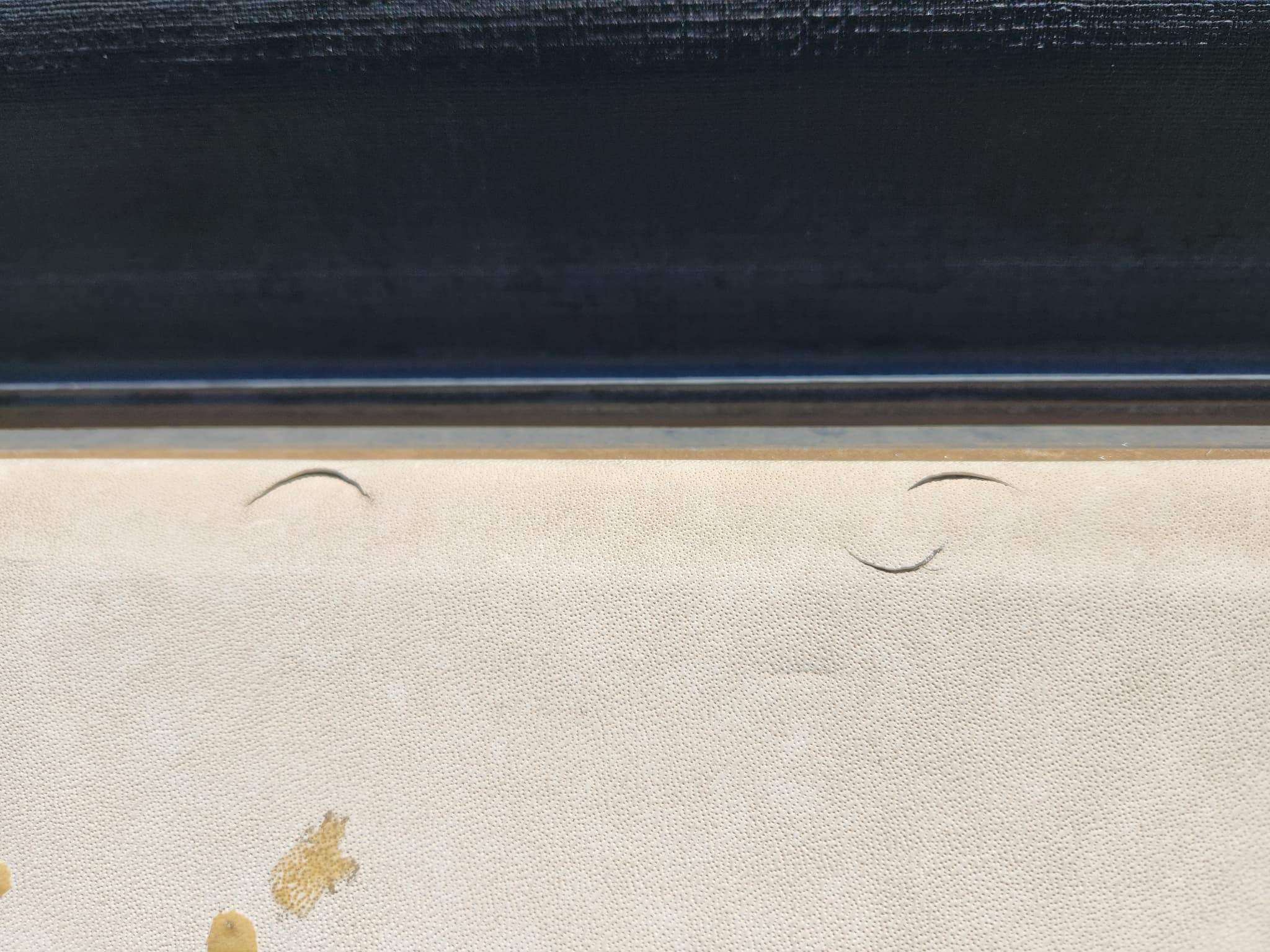 Damaged RV roof membrane with holes caused by hail before replacement