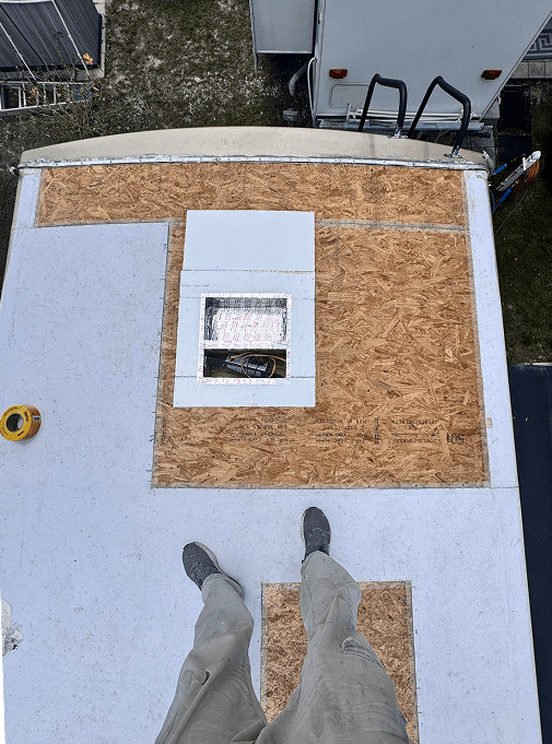 New OSB installed on damaged section of RV roof during repair