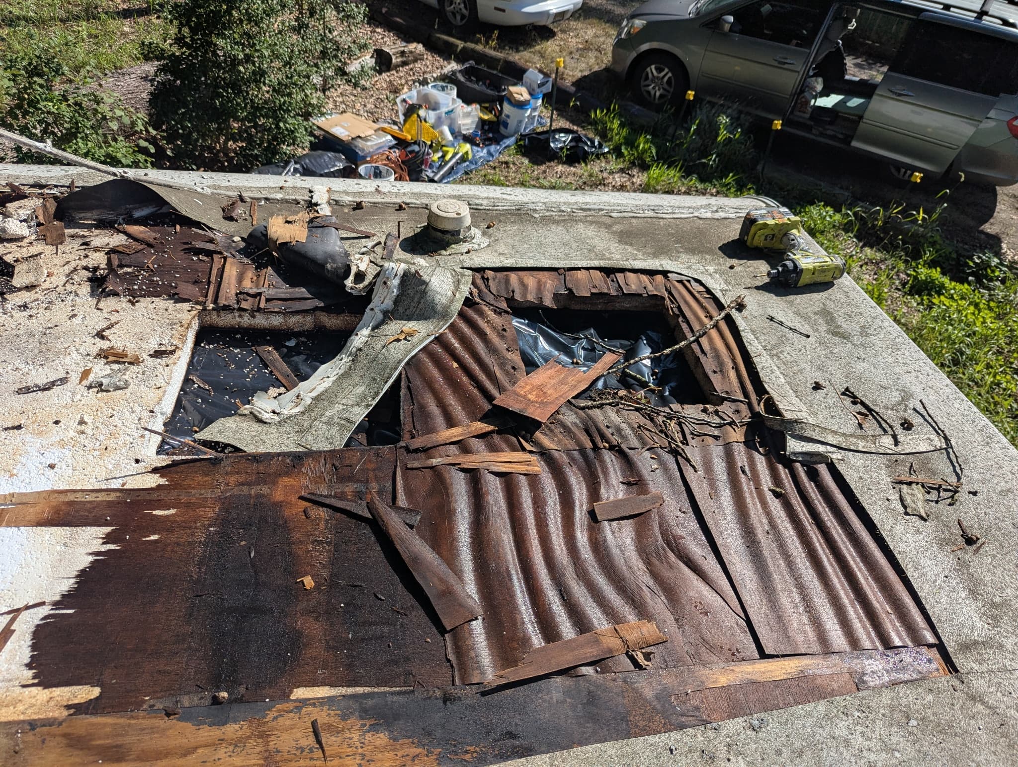 Wet rotten plywood under removed membrane