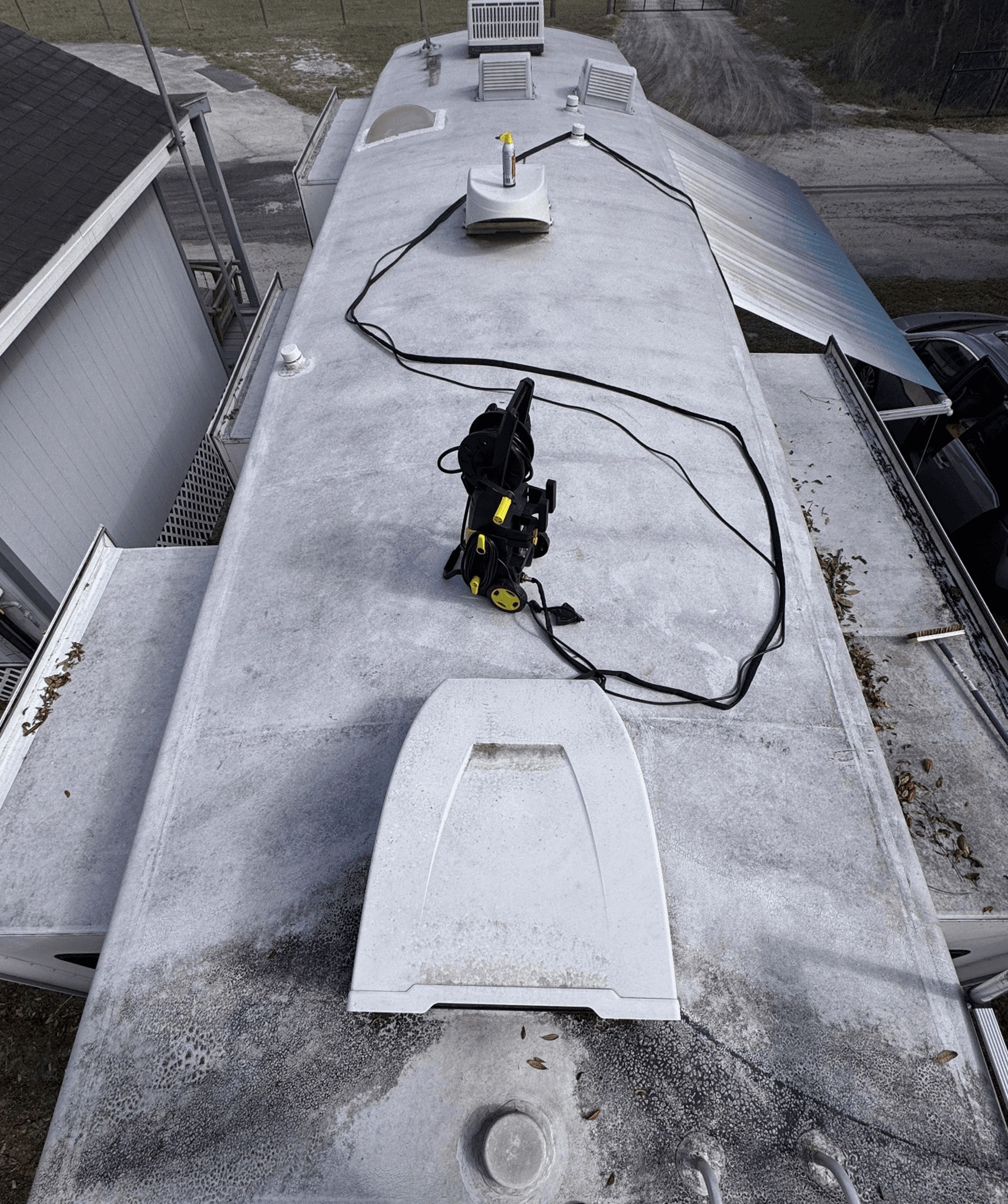 Aged RV roof before coating system installation in Tampa