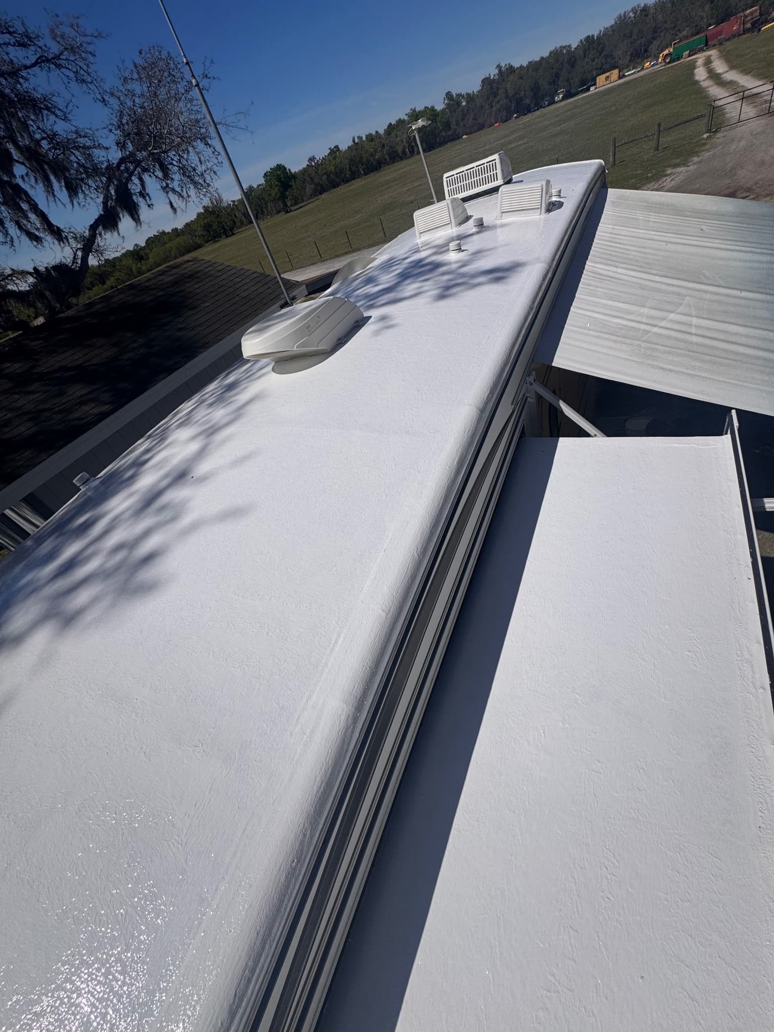 RV roof and slide-out protected with silicone coating system after maintenance